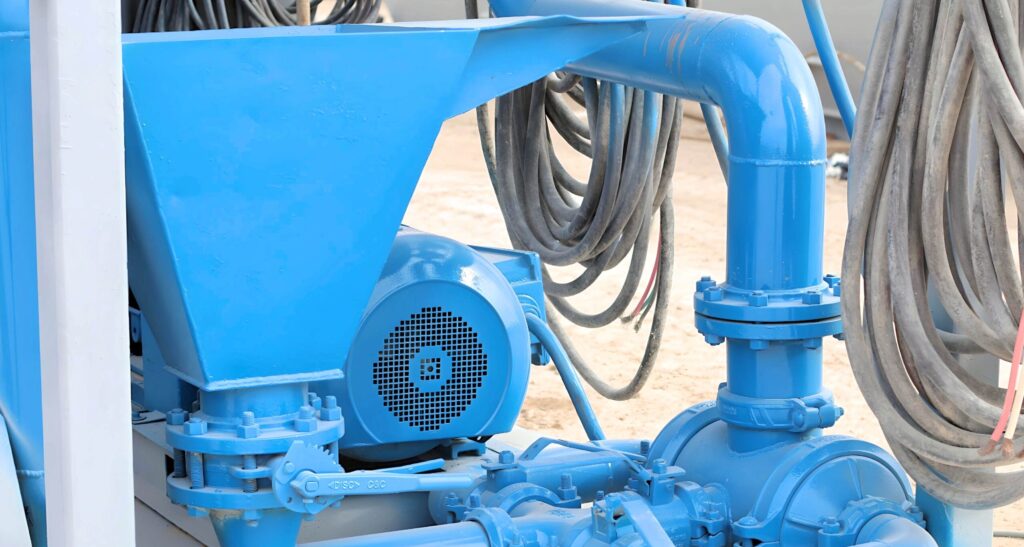 Blue industrial pump with hopper