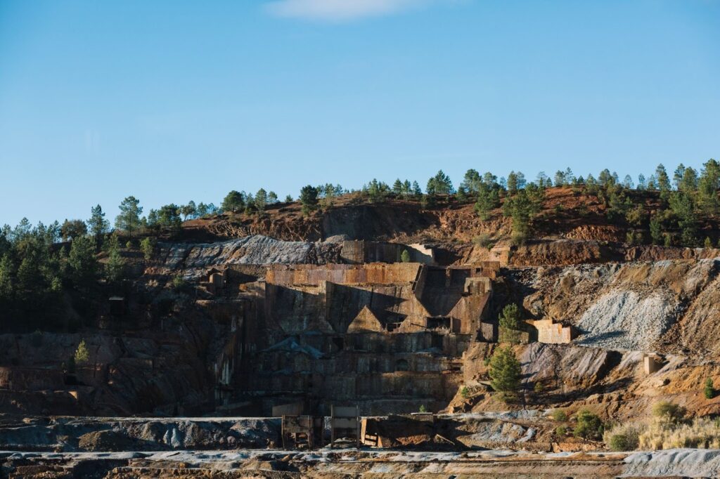 Terraced quarry with rusted structures