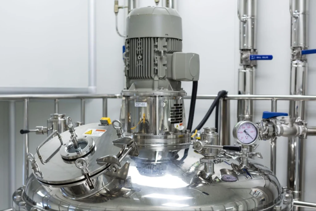 Stainless steel tank with attached motor